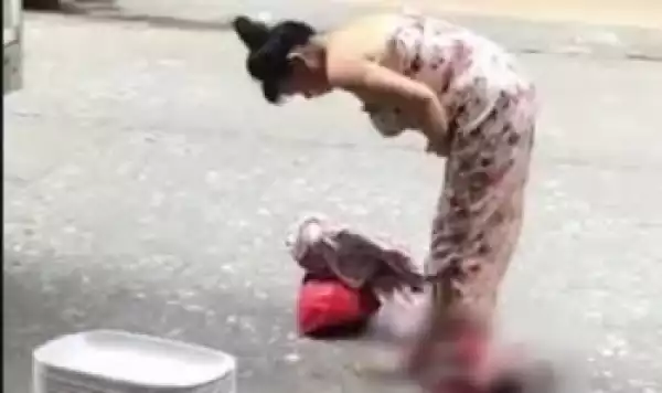 Woman Gives Birth In The Middle Of The Street, Picks Up Her Child And Walks Off